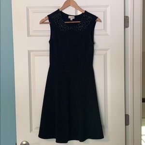 Black dress with beaded collar.